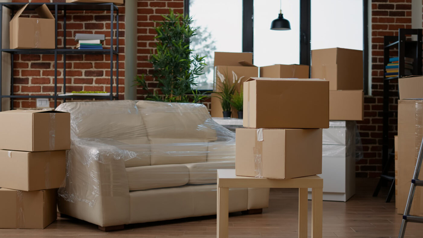 No people in living room interior to move in with carton boxes, empty real