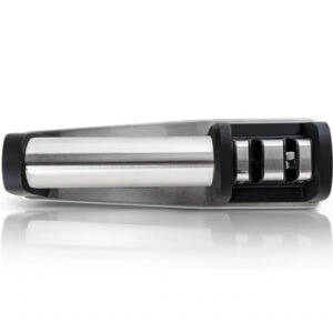 "Truper 15147 manual knife sharpener with two sharpening stages for precision. The sharpener features a durable plastic body, ergonomic handle, and two ceramic wheels for coarse and fine sharpening. Ideal for maintaining kitchen knives, it provides a secure, easy-to-use grip while restoring blade sharpness efficiently. Compact and portable design for convenient storage."