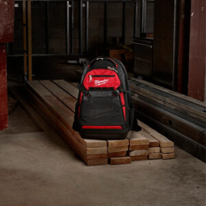 Milwaukee backpack on construction site with wood and tools, SAKR Building Materials Lebanon.