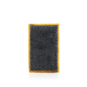 Heavy-duty black cleaning sponge with yellow border, ideal for construction and household use.