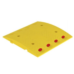 Yellow plastic leveling ramp with red reflectors for construction safety and leveling.