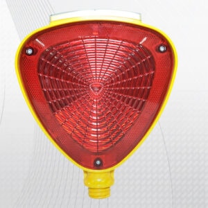 Red triangular warning light with yellow border, used for safety and signaling in construction sites.