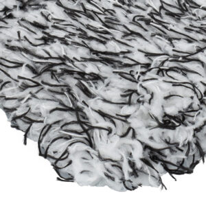Close-up of textile fabric with black and white fibers, showcasing quality material for construction.