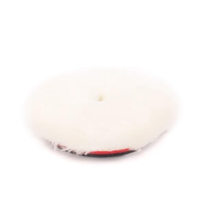 White polishing pad used for surface finishing in construction and building materials.