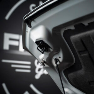 Hydraulic trunk lid support for vehicle durability and safety, showcased by SAKR Building Materials.