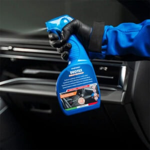 Disinfectant spray being used to sanitize car interior surfaces at Sakr Building Materials.