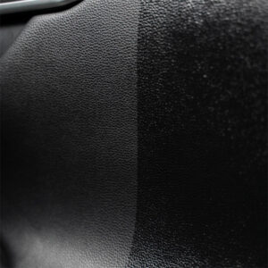 Close-up of textured black building material surface for construction projects.