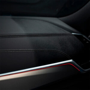 Close-up of a modern car dashboard with premium materials and sleek design.