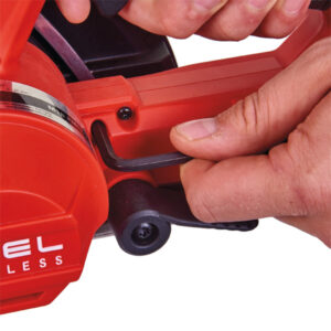 Close-up of a person using a power saw for building and construction projects.