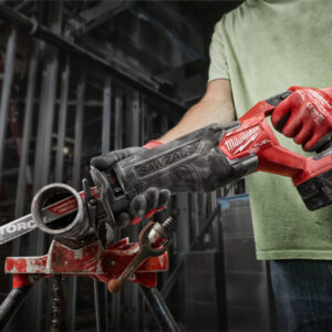 Powerful Milwaukee cordless drill being used for construction work at a building site.